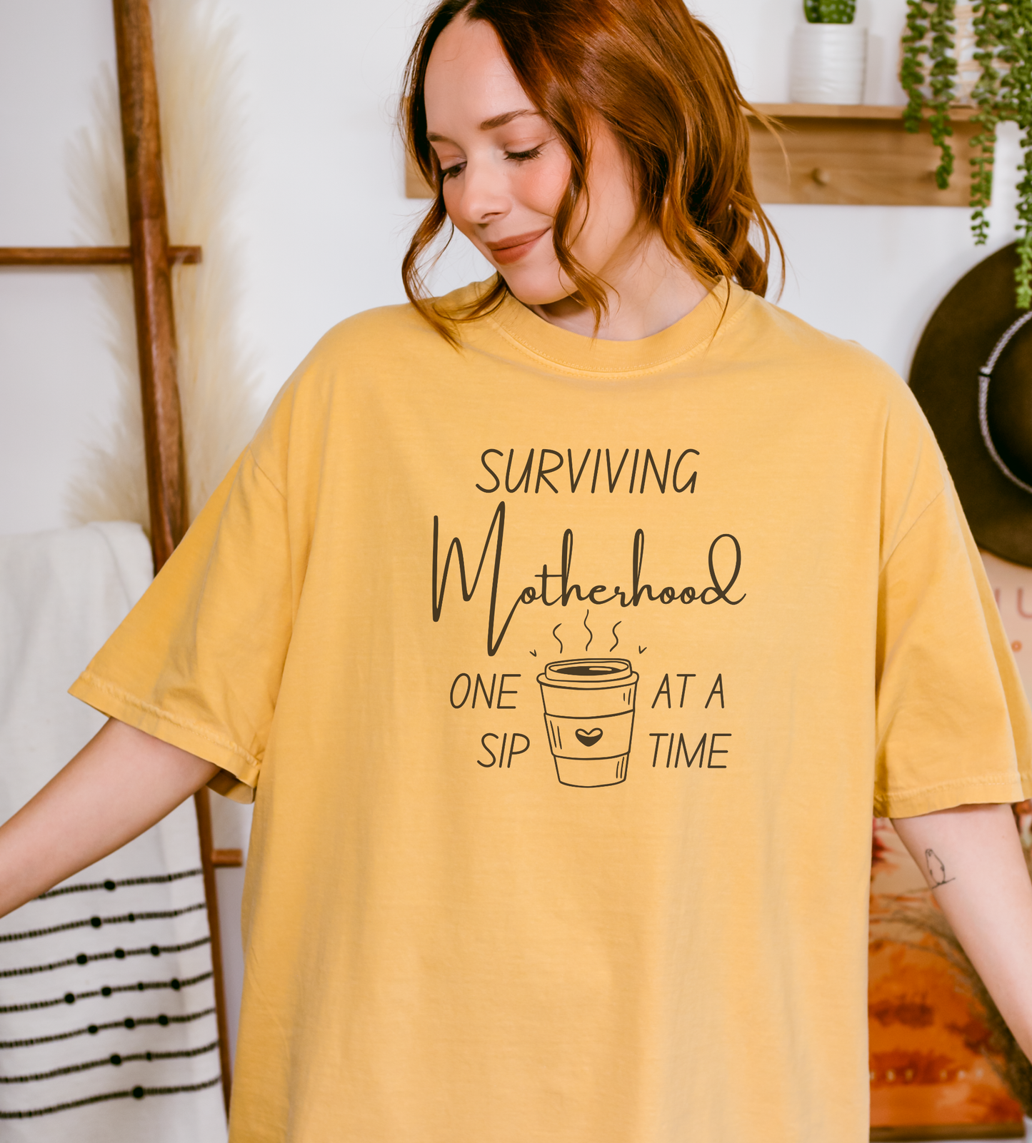 Surviving Motherhood One Sip at a Time Tee
